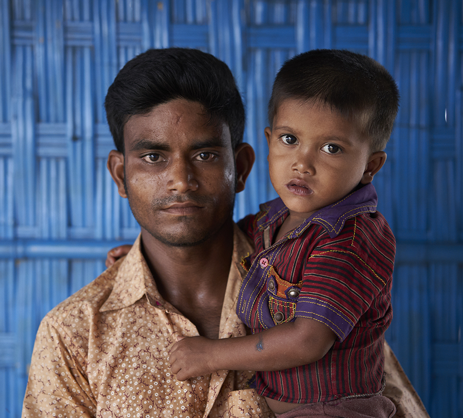Man with child on his hands.
